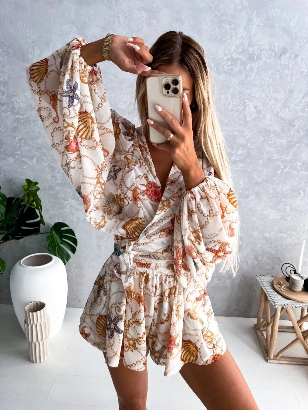 Bohemian V-Neck Wrap Jumpsuit with Flowing Sleeves and Tropical Elegance