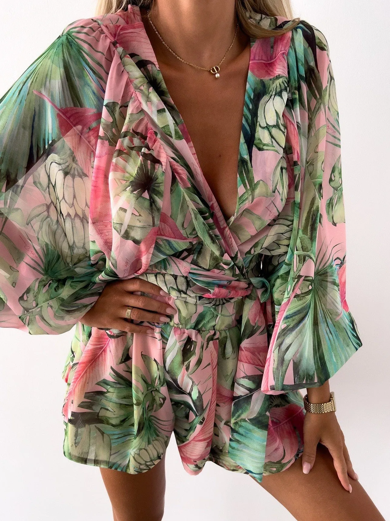 Bohemian V-Neck Wrap Jumpsuit with Flowing Sleeves and Tropical Elegance