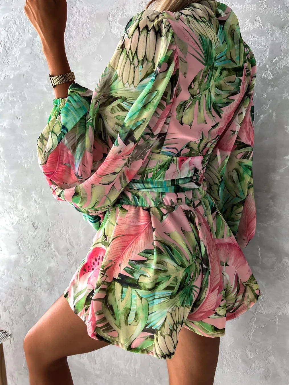 Bohemian V-Neck Wrap Jumpsuit with Flowing Sleeves and Tropical Elegance