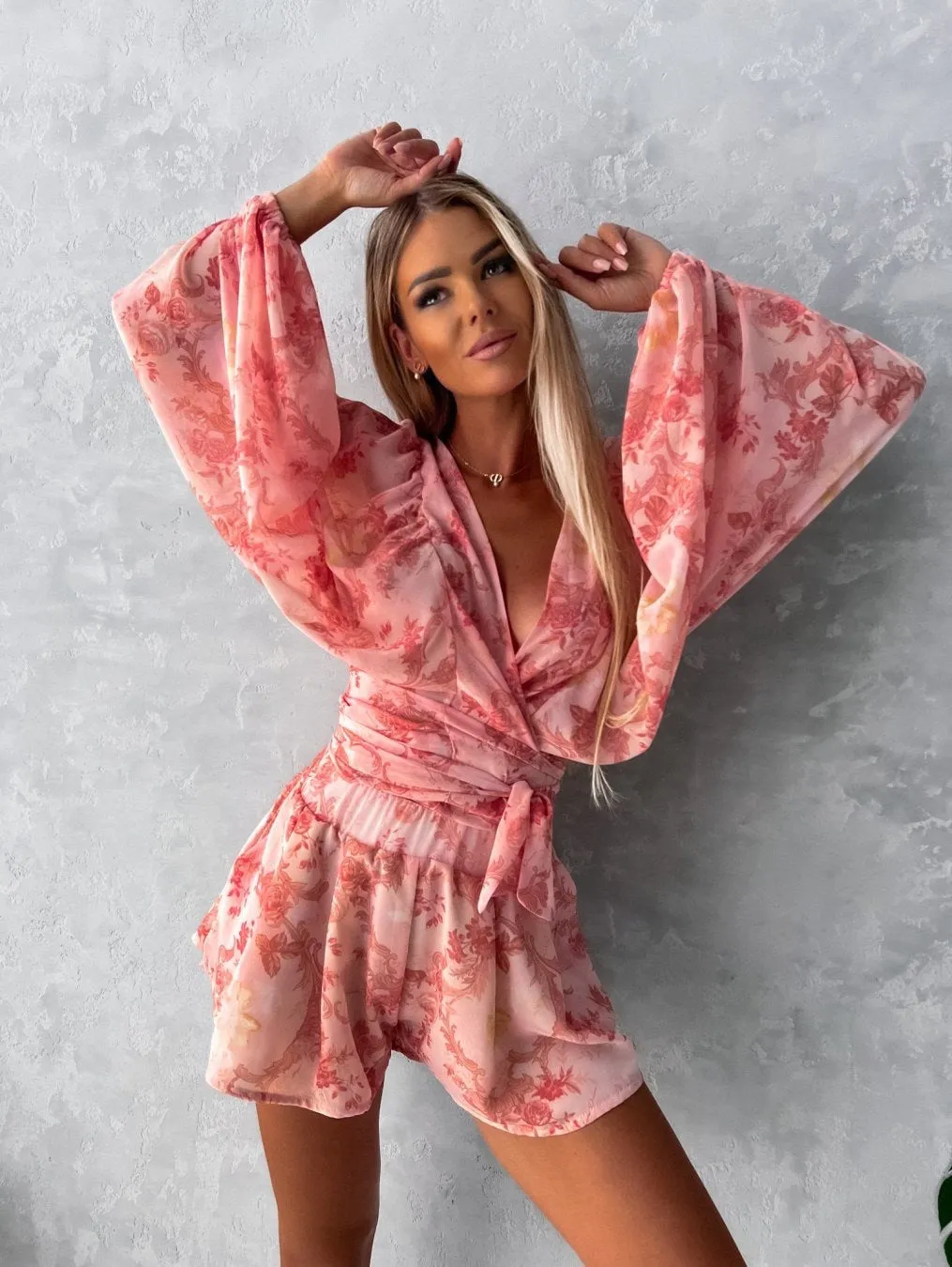 Bohemian V-Neck Wrap Jumpsuit with Flowing Sleeves and Tropical Elegance