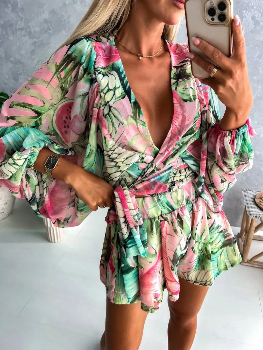 Bohemian V-Neck Wrap Jumpsuit with Flowing Sleeves and Tropical Elegance