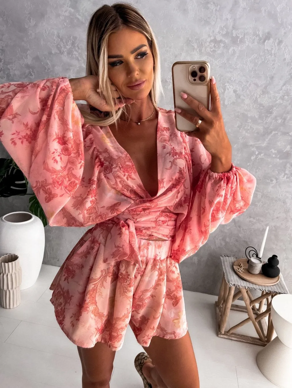 Bohemian V-Neck Wrap Jumpsuit with Flowing Sleeves and Tropical Elegance