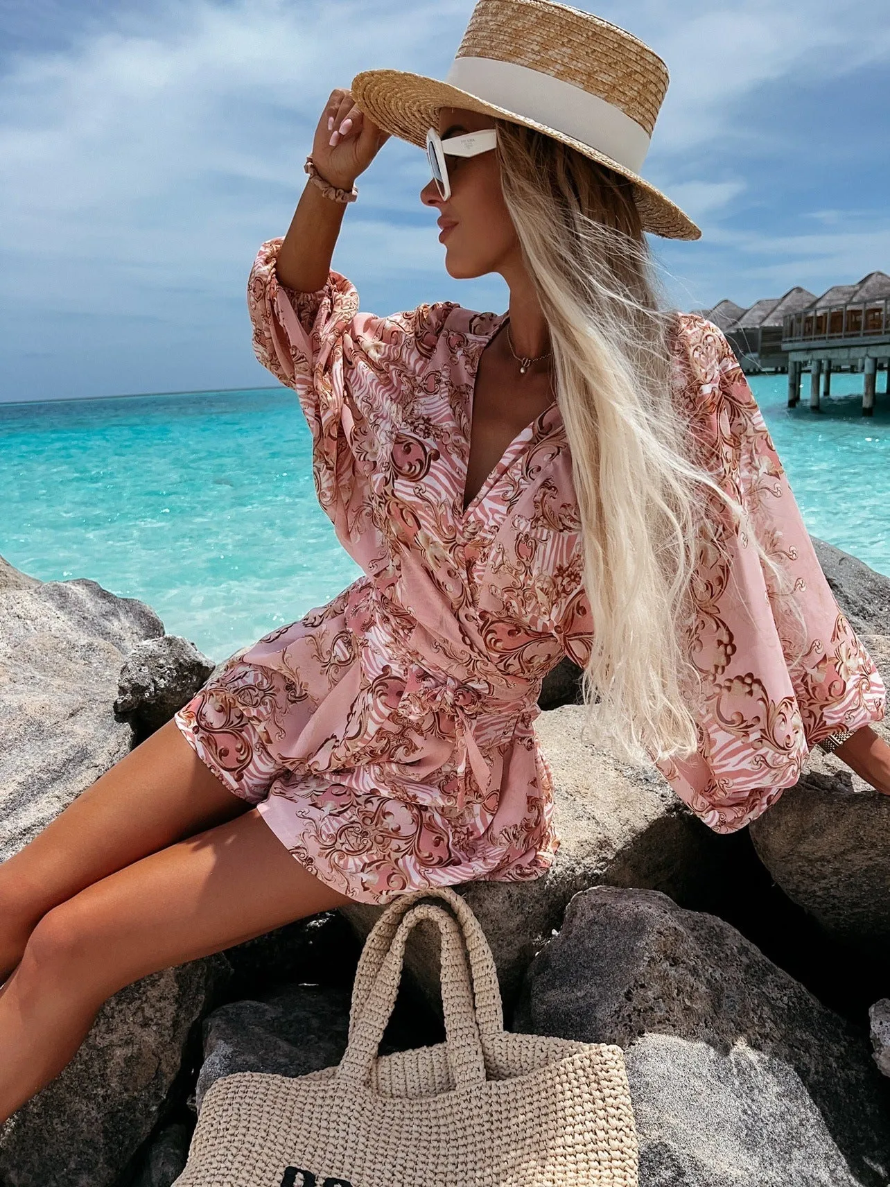 Bohemian V-Neck Wrap Jumpsuit with Flowing Sleeves and Tropical Elegance