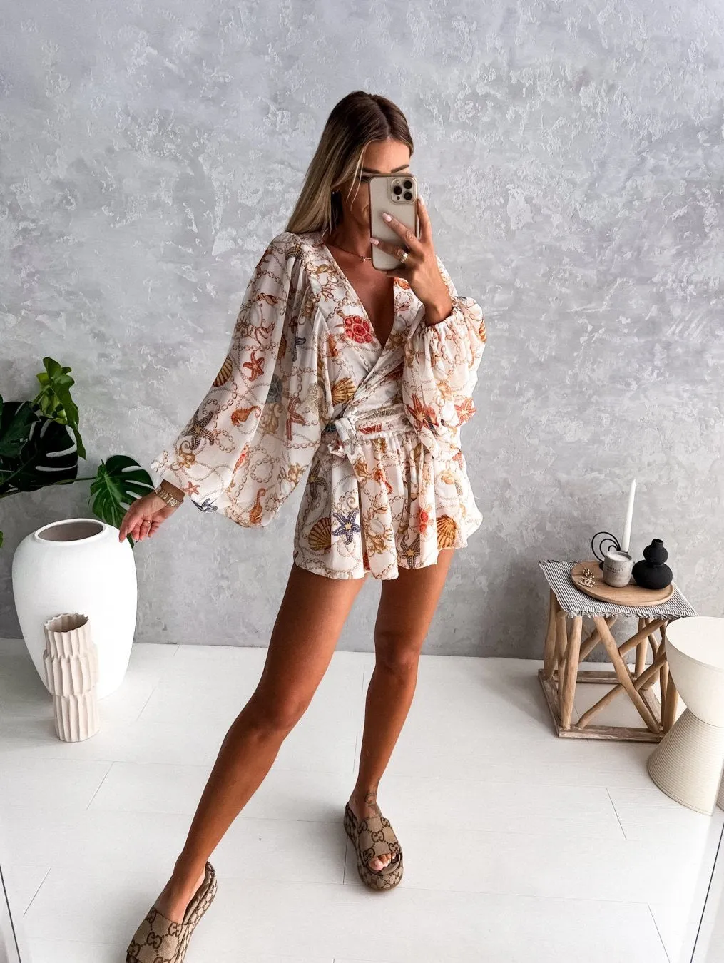 Bohemian V-Neck Wrap Jumpsuit with Flowing Sleeves and Tropical Elegance