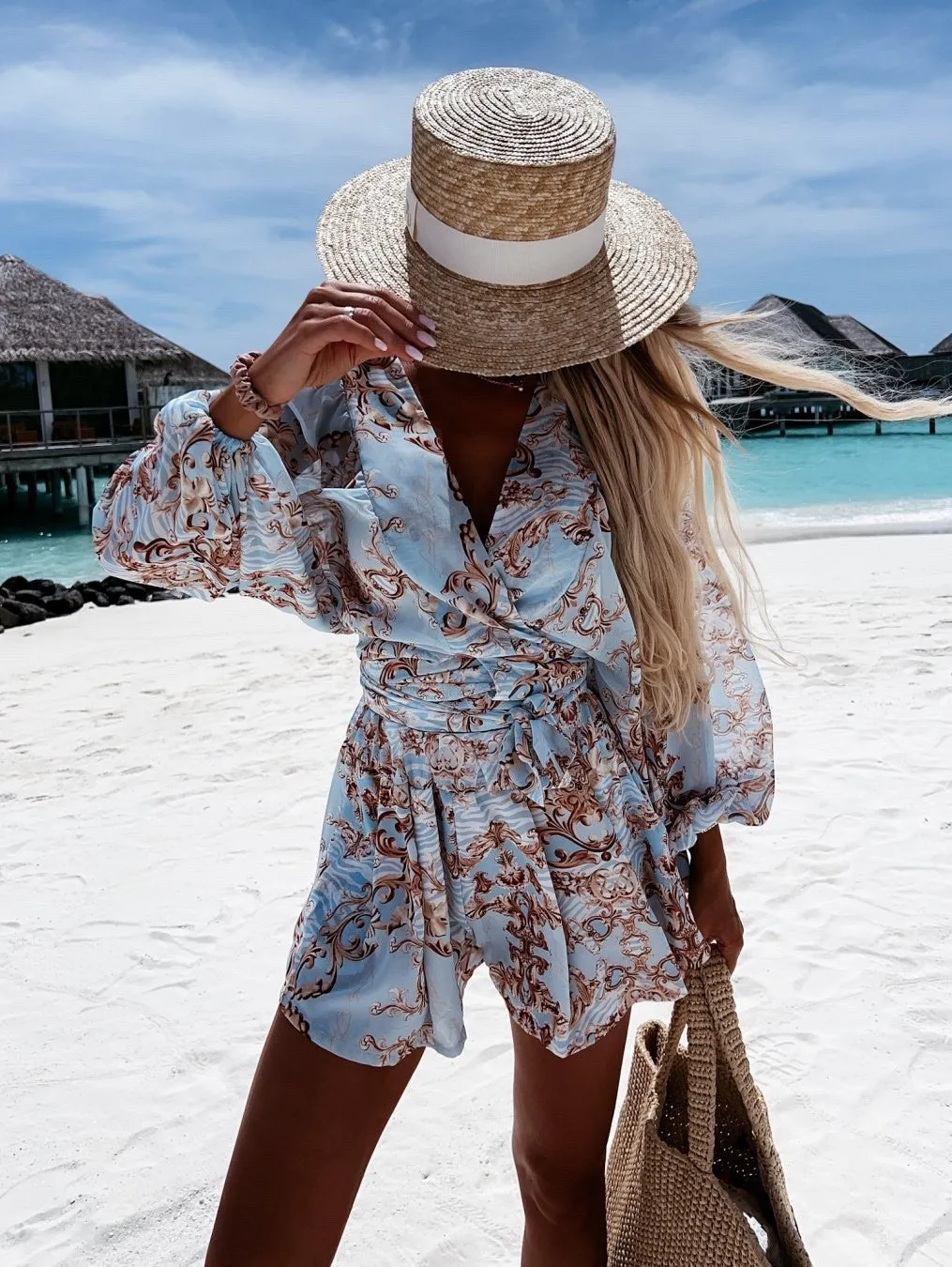 Bohemian V-Neck Wrap Jumpsuit with Flowing Sleeves and Tropical Elegance