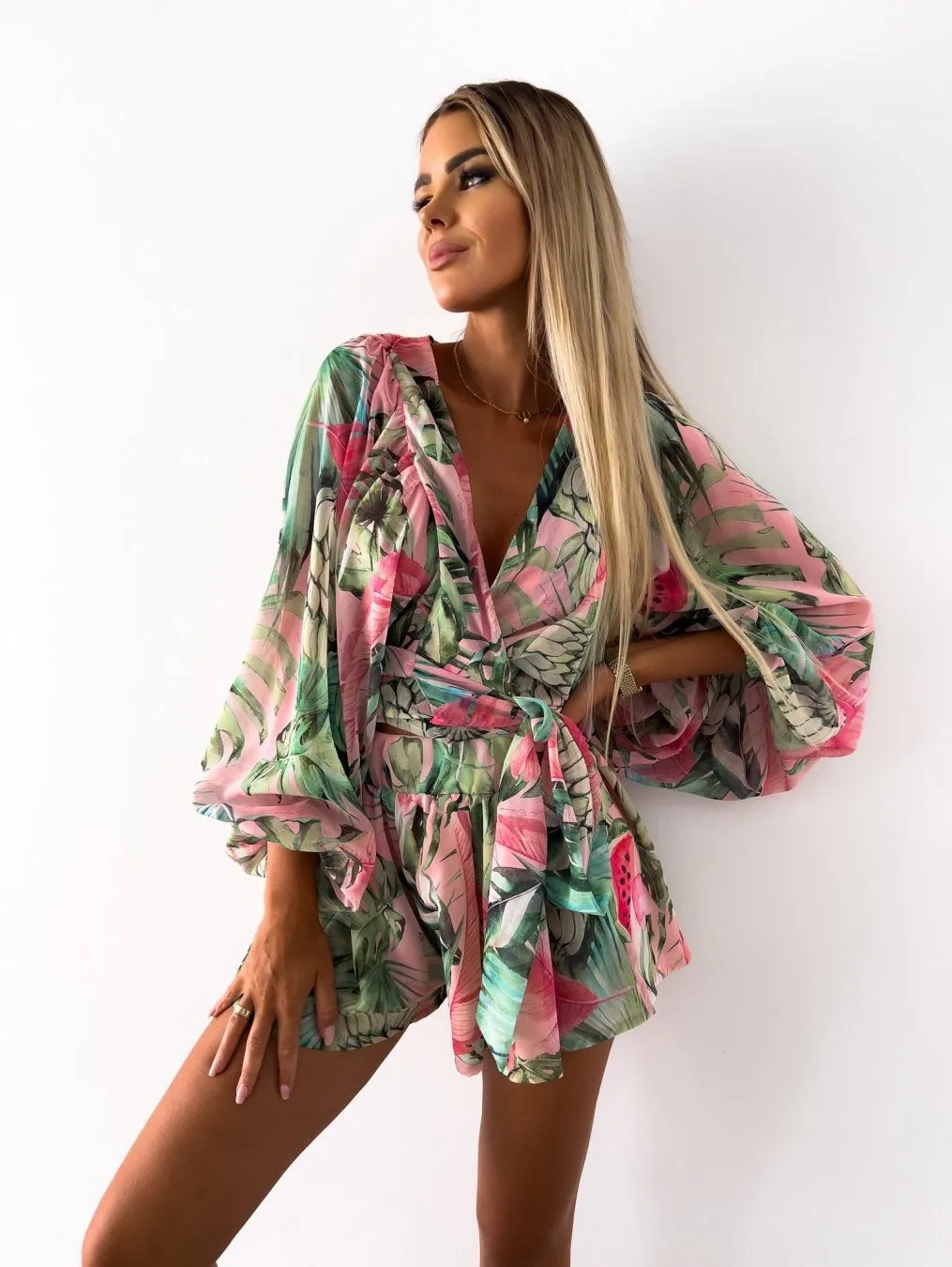 Bohemian V-Neck Wrap Jumpsuit with Flowing Sleeves and Tropical Elegance
